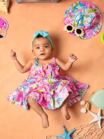 A full lay-flat view of our summer flamingo theme. This setup is perfect for younger infants, creating a colorful and playful scene around them.
