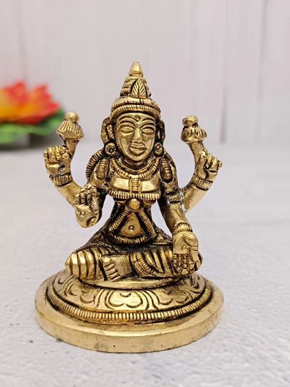 A finely crafted brass idol of Goddess Lakshmi, perfect for bringing wealth and prosperity to your home.