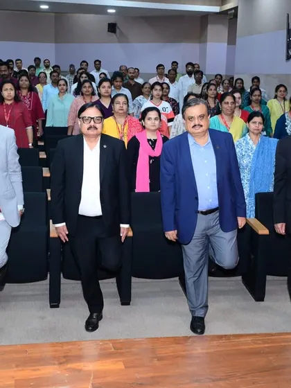 Senior officials at ONGC practicing balancing exercises from their seats. These simple movements help improve focus and coordination, skills that are valuable both in and out of the office.