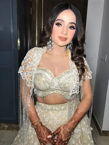 The full look is modern, chic, and perfect for a sangeet or engagement party.