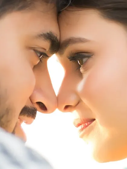 Sometimes, the most powerful stories are told in the quietest moments. This intimate pre-wedding close-up, with the sun creating a natural flare, is all about capturing the raw connection and unspoken love between a couple.