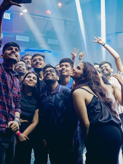 A group selfie with partygoers in the middle of the dance floor. I love it when the crowd's energy is so high they become part of the show.