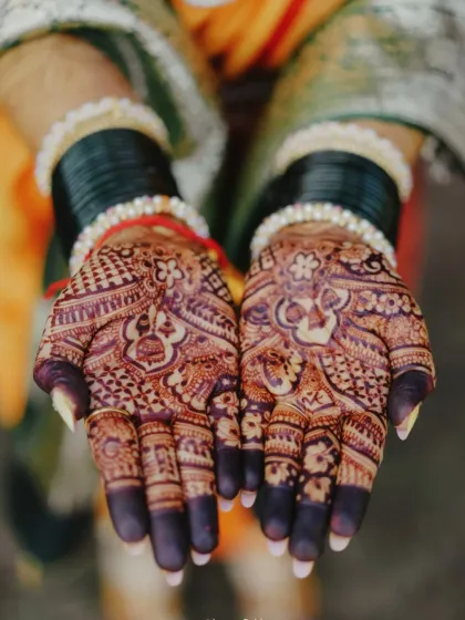 The final result: a deep, dark, and even stain across both palms, ready for the wedding festivities.