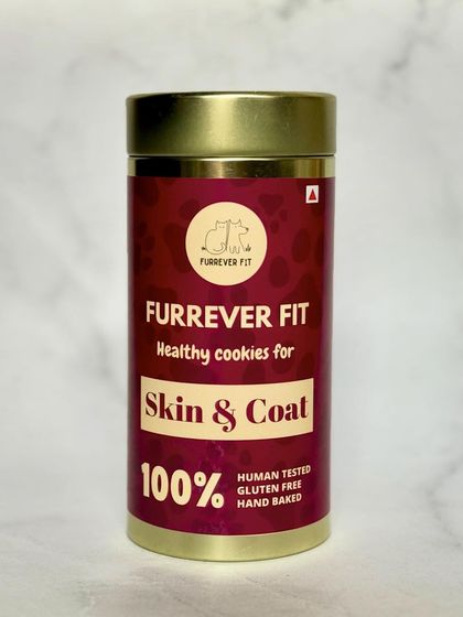 A close-up of the Skin & Coat healthy cookies packaging. The rich color comes from natural ingredients, not artificial dyes. These are hand-baked and gluten-free.