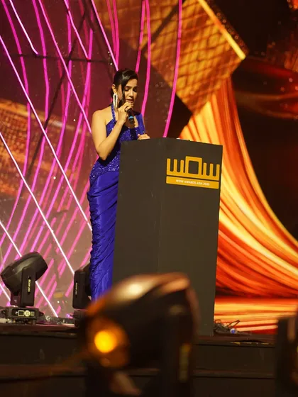 A side-angle shot from the stage, focused on delivering the script for the WOW Awards. Professionalism and preparation are key for these events.
