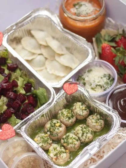 For lovers of Italian food, our Date Night Meal for 2 in the Veg option. It includes dishes like stuffed mushrooms, ravioli, a fresh salad, and a chocolate dessert.