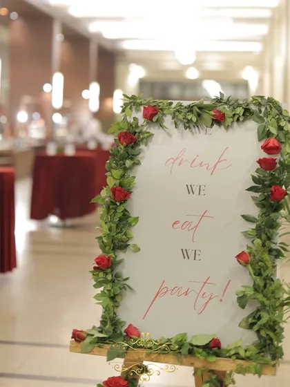 A fun and stylish sign that reads "drink, eat, party!", perfectly setting the mood for the celebration to come.