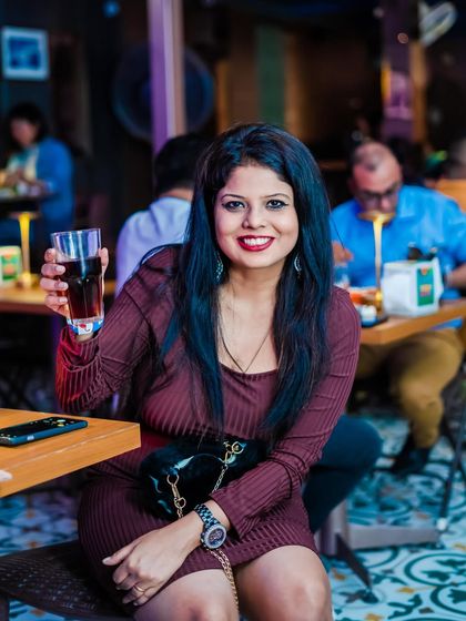 A guest enjoying a drink at her table. My events cater to those who want to dance the night away and those who prefer to sit back and soak in the vibe.