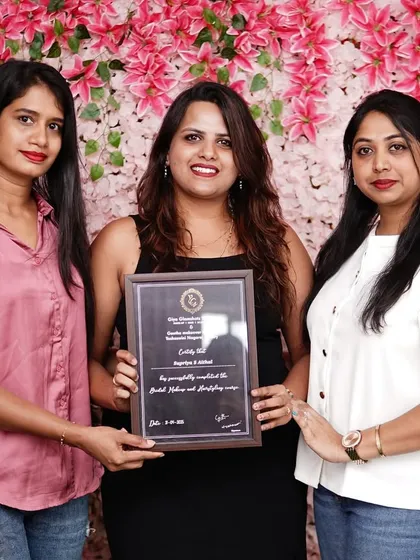 It is a proud moment for me to present a certificate of completion. Every student gets personal guidance, and I love seeing them ready to start their careers as professional makeup artists.