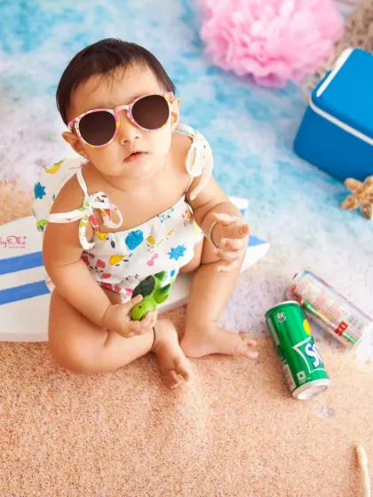 Bringing the beach to my Powai studio for this adorable little one. Themed shoots like this 'Beach Baby' session are a wonderful way to celebrate a milestone with vibrant colors, fun props, and lots of personality.