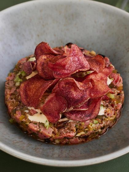 A clean, top-down shot of the Seared Steak Tartare, ready to be enjoyed.