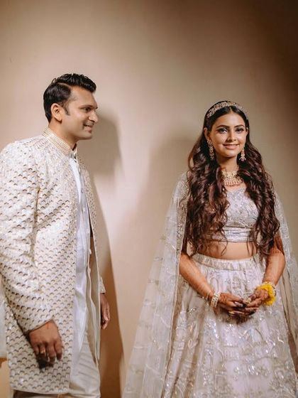 A lovely portrait of the couple, capturing the bride's happy smile as she looks at her groom.