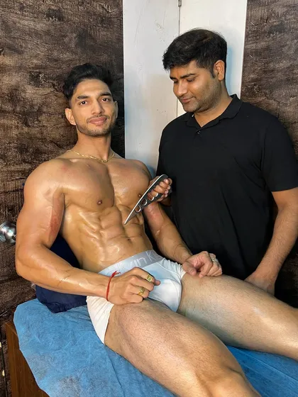 Using a feather-shaped IASTM tool to work on the chest of a fitness athlete. Different tools allow me to target different muscle contours and depths for a more precise treatment.