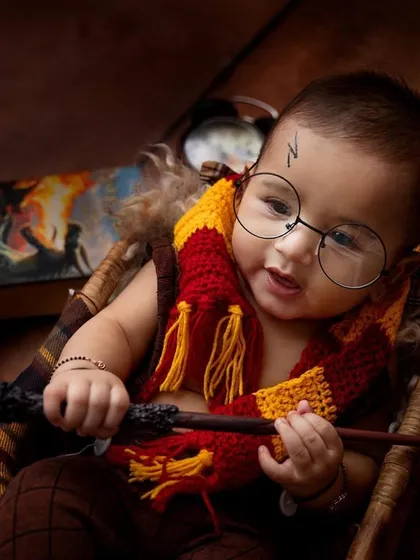 The famous lightning bolt scar and a happy magical spell! This shot captures the playful side of our Harry Potter session. It’s amazing to see these little ones interact with the props and bring the character to life.