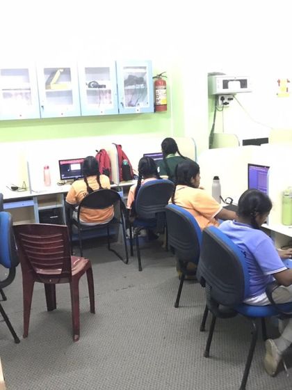 Students at Cee Dee Yes Public School are focused on their screens during an AI and Python workshop, learning the fundamentals of programming in a structured lab environment.