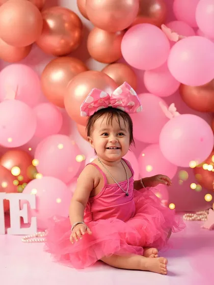 A huge, happy smile says it all. This is the joy we aim to capture in every first birthday photoshoot, a memory of pure happiness for the family to cherish.