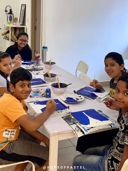 A group of kids engaged in an acrylic painting class, learning new techniques and having fun together.