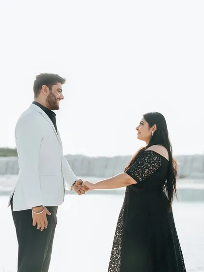 A classic portrait of the couple holding hands and looking at each other, set against the unique backdrop of a white quarry.