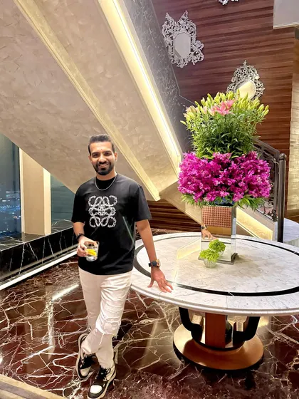 Down to earth, but still above you. A casual but stylish look for a night out in Mumbai with a great city view.
