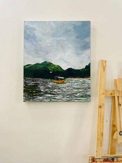 The finished painting of Banasura Sagar Dam, Wayanad, on a 20 by 24-inch canvas. I used acrylics to capture the serene water, the lush green hills, and the cloudy sky.