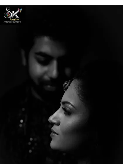 A moody and artistic black and white portrait from an engagement ceremony. This style adds a dramatic and timeless feel to your wedding album.