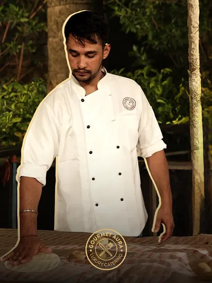 A chef preparing dough at an outdoor event, showcasing the fresh, hands-on approach we take, no matter the setting.