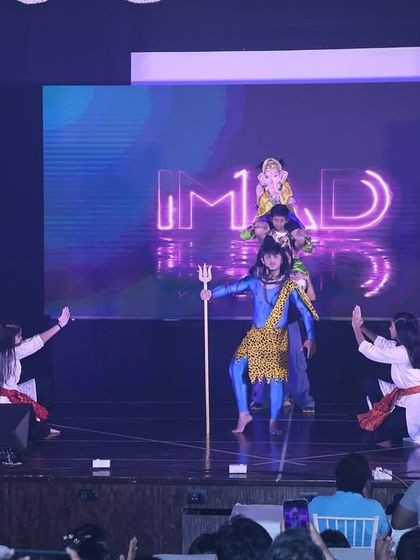 This scene from our Shiv prayer dance depicts a divine story. We use character costumes, props like the Trishul, and expressive choreography to narrate mythological tales.