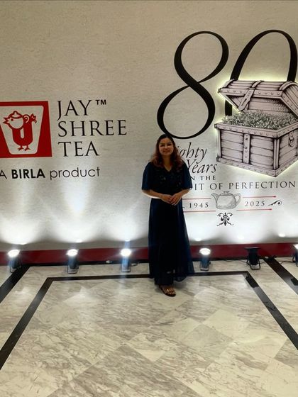 Standing proudly by the event branding for Jay Shree Tea's 80th-anniversary celebration. It's wonderful to be part of such historic corporate milestones.