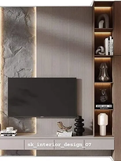 This TV unit combines rough stone texture with smooth fluted panels for a tactile experience. The built-in shelving with backlighting is perfect for displaying books and artifacts.