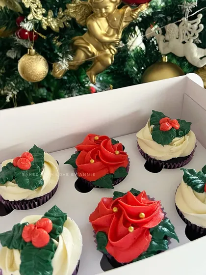 Nothing ushers in the holiday spirit like a box of my signature cupcakes, adorned with delicious buttercream in festive hues of red, green, and white.
