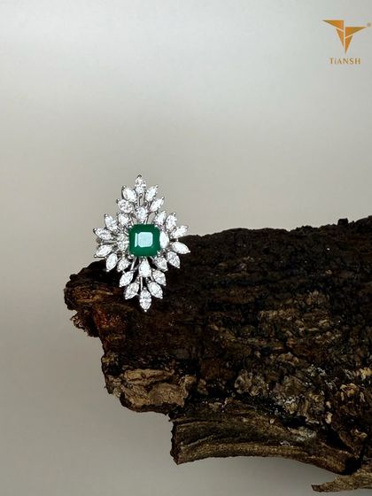 An emerald at the center, with diamonds like leaves unfolding around it. This ring feels less like a design and more like nature’s own art, captured from my 'Whispers of the Earth' collection.