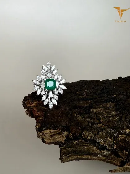 An emerald at the center, with diamonds like leaves unfolding around it. This ring feels less like a design and more like nature’s own art, captured from my 'Whispers of the Earth' collection.