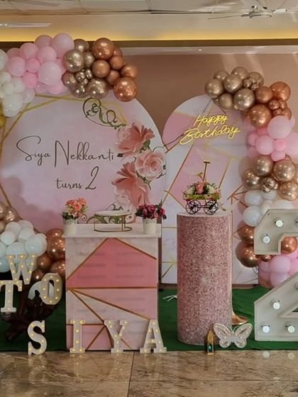 A close-up of the sophisticated butterfly-themed 2nd birthday party with modern geometric backdrops.