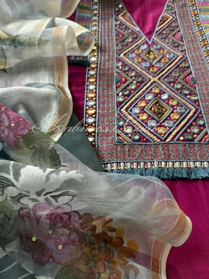 A close-up view that highlights the fine dabka and sequin details within the embroidery, contrasting with the delicate painting on the dupatta.