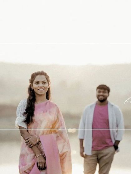 A simple portrait of the bride-to-be, with her partner slightly out of focus in the background, creating a sense of anticipation.
