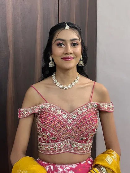 A front facing view of the minimal glam makeup. The focus is on well defined brows, subtle eyeshadow, and a flawless skin finish, perfect for any wedding season event.
