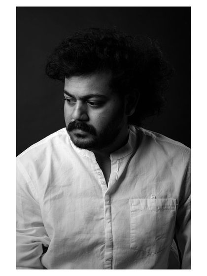 A strong and character-driven black and white portrait of an actor. The lighting is dramatic, highlighting his features and creating a compelling headshot.