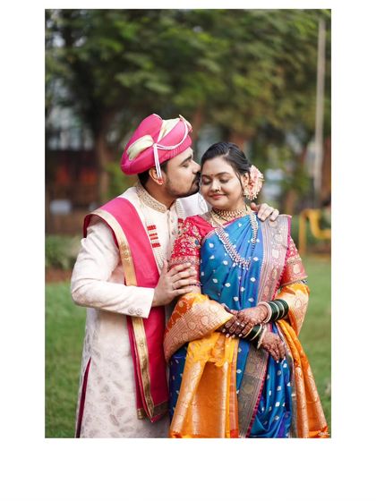 A sweet forehead kiss, a timeless romantic portrait of the newly married couple.