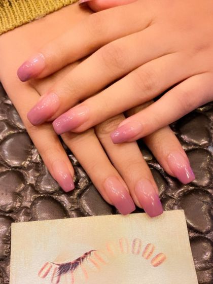 A soft and elegant mauve ombre on long, square-shaped nails. The subtle gradient provides a clean and polished finish.