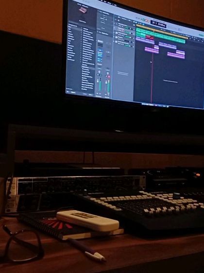 Another glimpse into the studio setup. The mixing console is where the magic happens, balancing all the elements to create the final sound.
