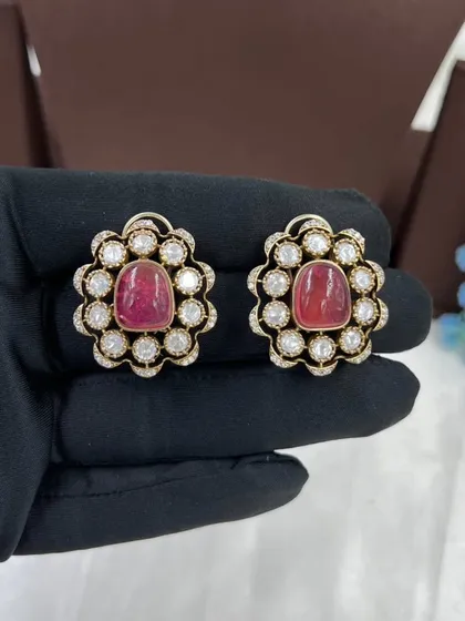 A close-up of the ruby stud earrings.