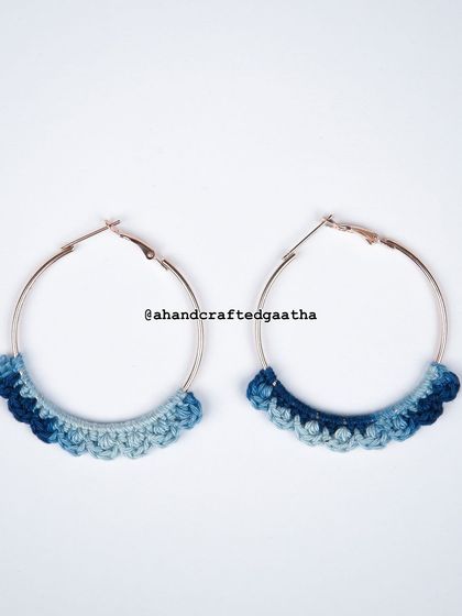 A product shot of the denim blue hoops, showcasing the beautiful gradient of blues from light to dark. Each pair is slightly unique.