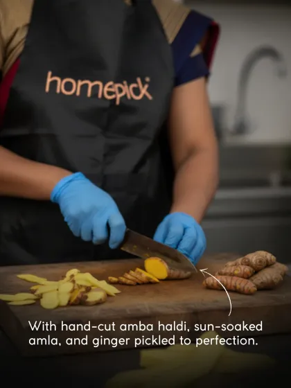Precision in every slice. Here, one of our team members is hand-cutting amba haldi (mango ginger) for our winter collection. This manual process ensures the texture is perfect in every jar.