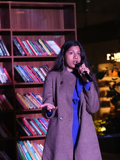A performer captivates the audience at our Worldmark Delhi show. We select poets who have a strong stage presence and can connect deeply with the crowd.