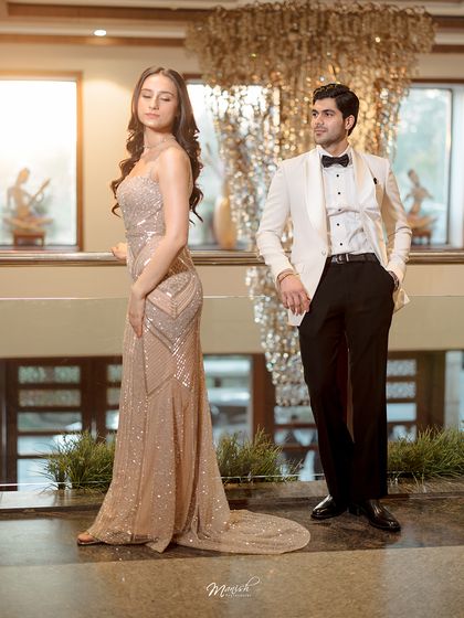 A stylish, posed shot that looks like a magazine editorial. We work with couples to create high-fashion pre-wedding looks that are both elegant and powerful.