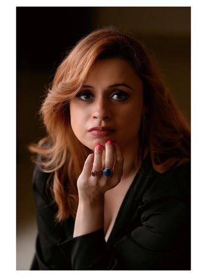 A soft and gentle portrait with beautiful window lighting. The model's expression is calm and serene, creating an intimate and peaceful image.