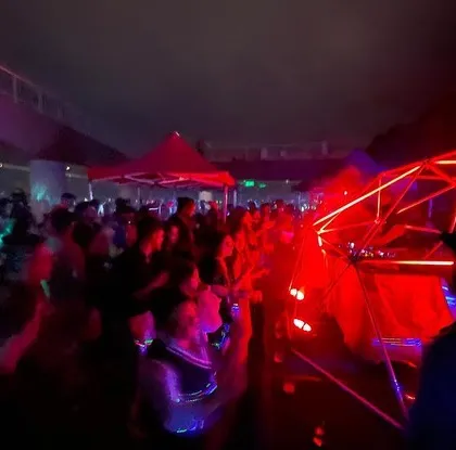 A wide shot of the incredible party scene in Bangalore. The combination of the unique stage setup and the energetic crowd made for a truly memorable night.