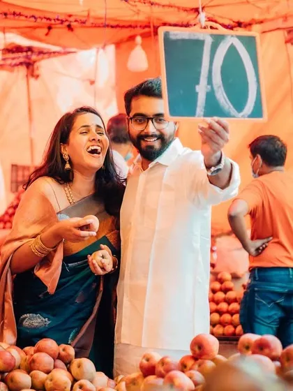 A moment of pure joy and laughter at a local fruit market. These candid, interactive shoots result in photos that are full of life and personality.