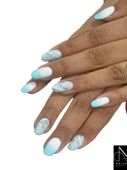 A cool and refreshing design featuring a white and aqua ombre, with a beautiful blue and white marble accent nail.