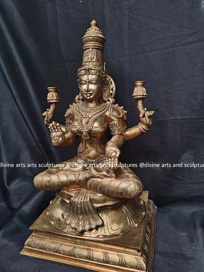 An authentic handmade bronze Lakshmi icon. The rich, warm glow of the polished bronze enhances her divine presence as the goddess of fortune.